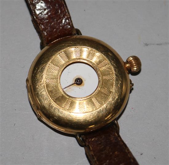 A 18ct gold Swiss half hunter wrist watch.